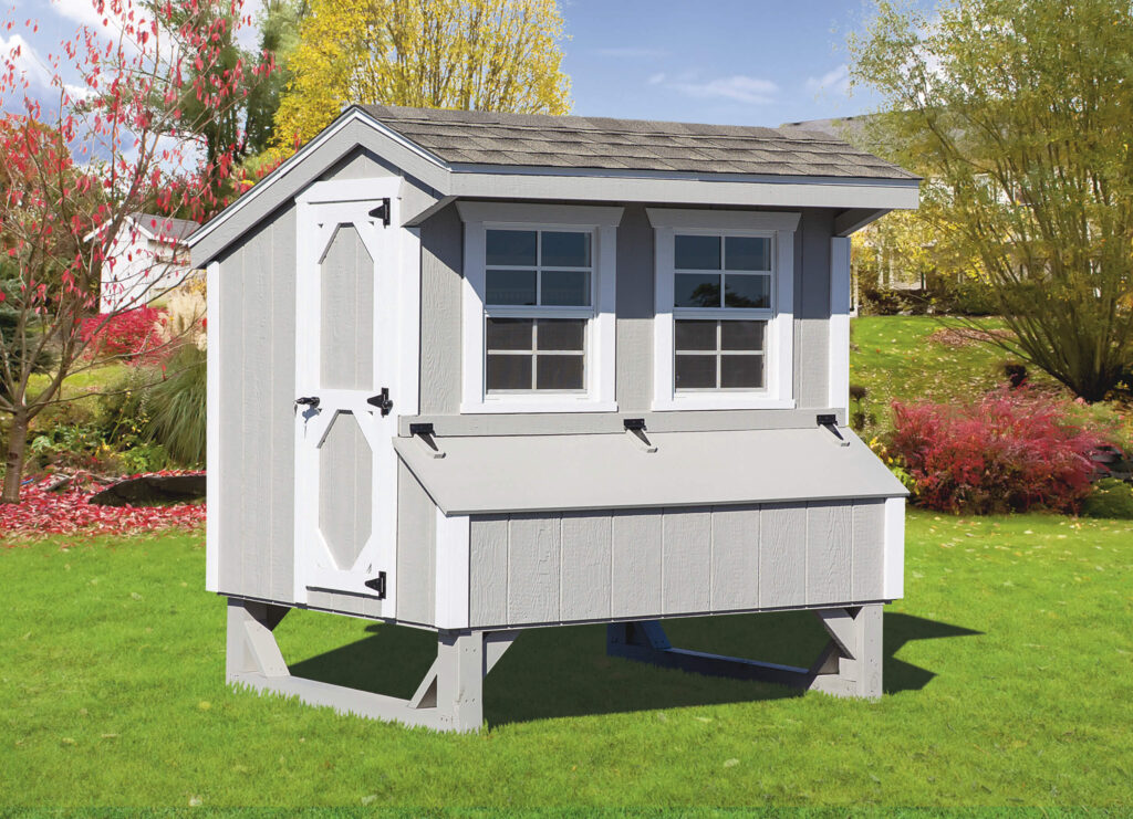 Gray Quaker chicken coop for sale in a yard
