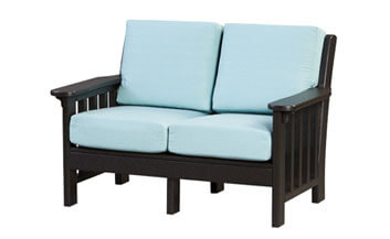 an outdoor love seat with blue cushions