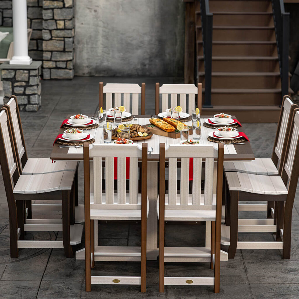 An outdoor dining set with eight chairs and a matching table, filled with food