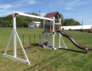 White and red vinyl swing set with three swings and a slide