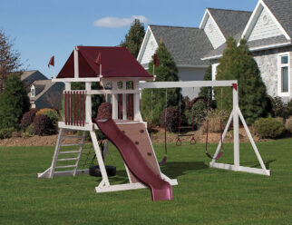 Red and white vinyl swing set in a backyard