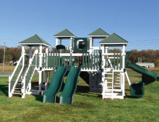 White and green vinyl swing set with four towers and 3+ slides