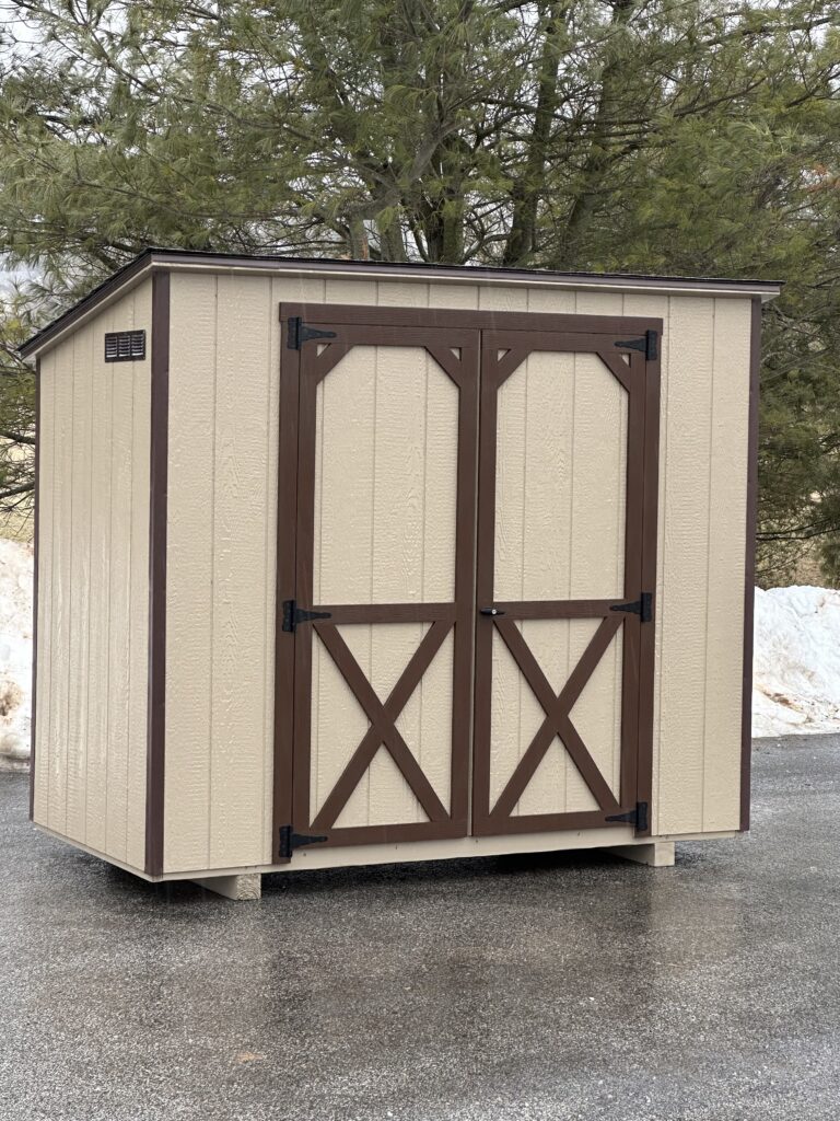 In stock mini townhouse tan shed with dark brown trim