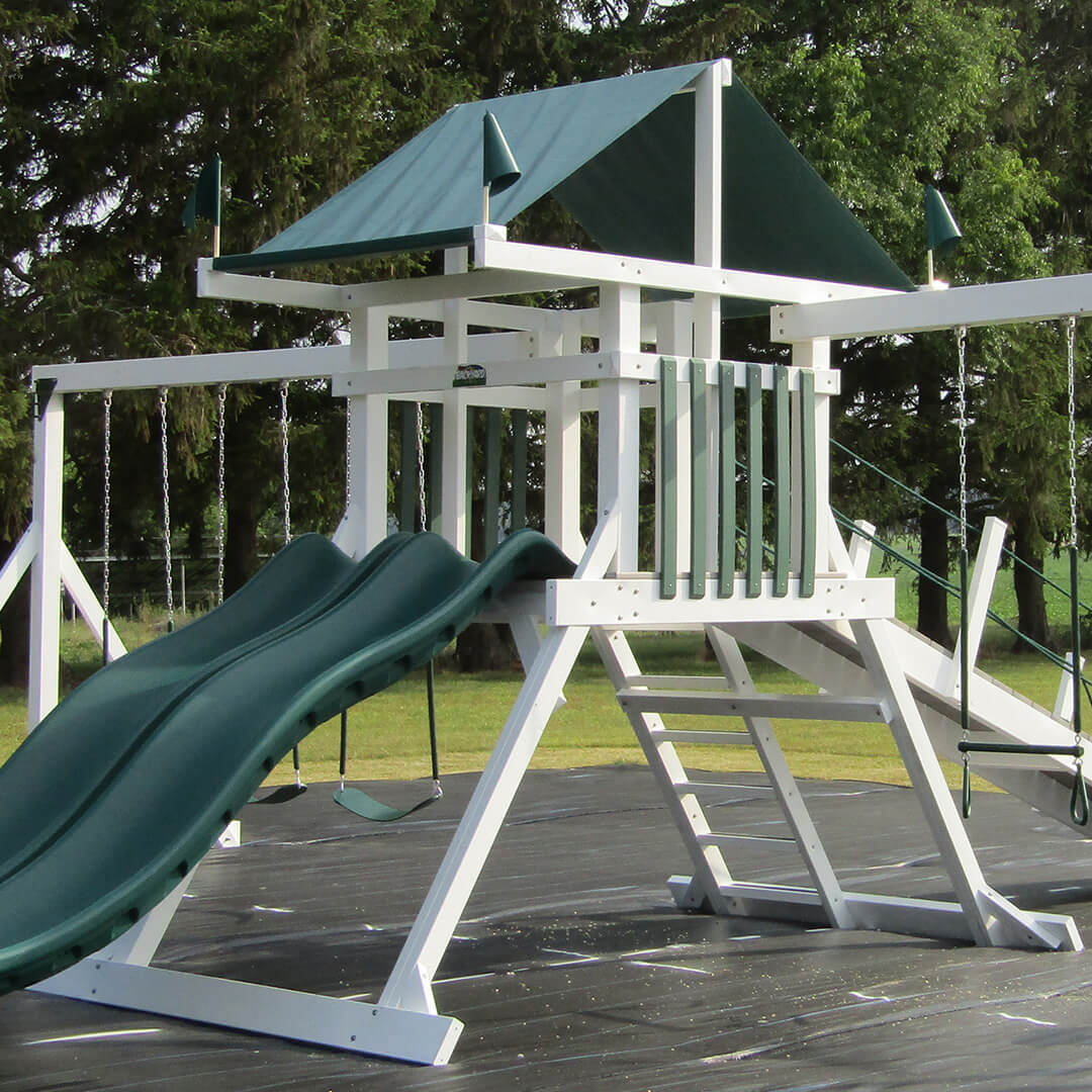 White A-frame swing set tower with a green roof