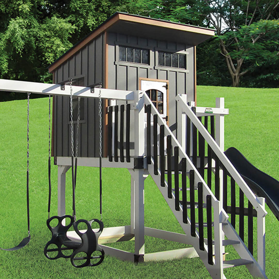 Gray playhouse with slide and swings